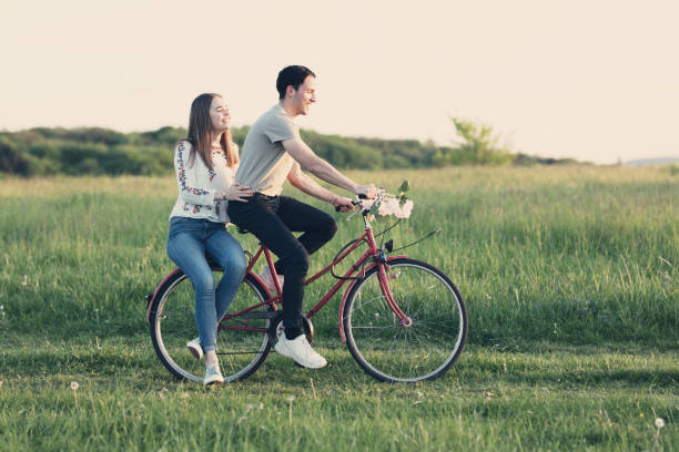 istock Young couple on bicycle in summertime 691761754