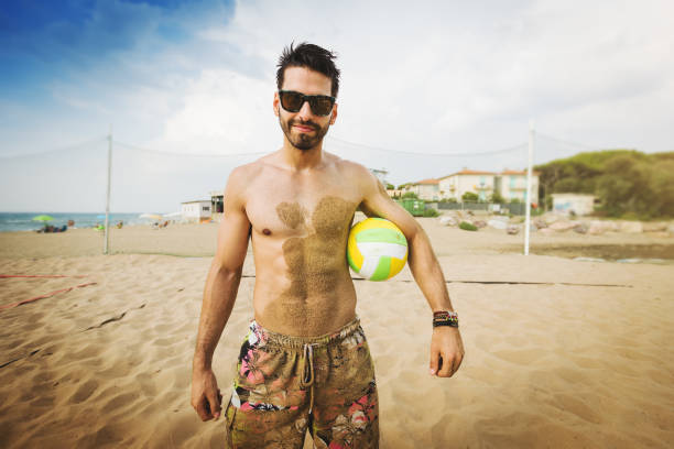 Friends play beach tennis and have fun