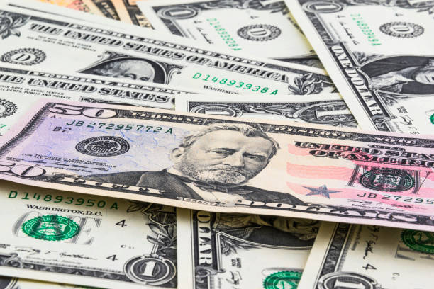 istock dollar money background photo. 691768328
