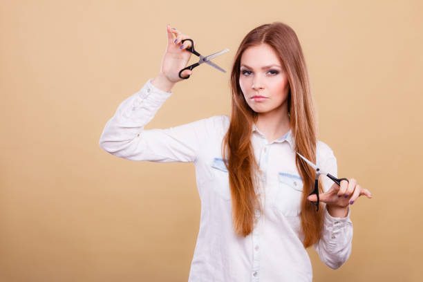 istock Young professional hairdresser with scissors. 691771880