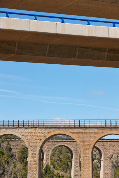 istock Old stone bridges and new concrete highways. Teruel, Spain 691772022