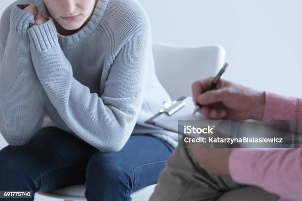 Girl During Session With Psychotherapist Stock Photo - Download Image Now - Abortion, Psychotherapy, Mental Health Professional