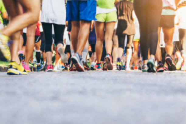 Marathon runners Crowd People outdoor Sport event Marathon runners Crowd People race Outdoor Sport event Healthy lifestyle feet on feet stock pictures, royalty-free photos & images