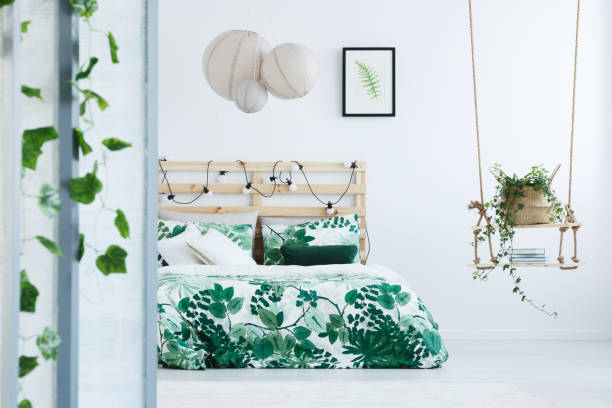 istock Botanical bedroom with wooden bed 691782170