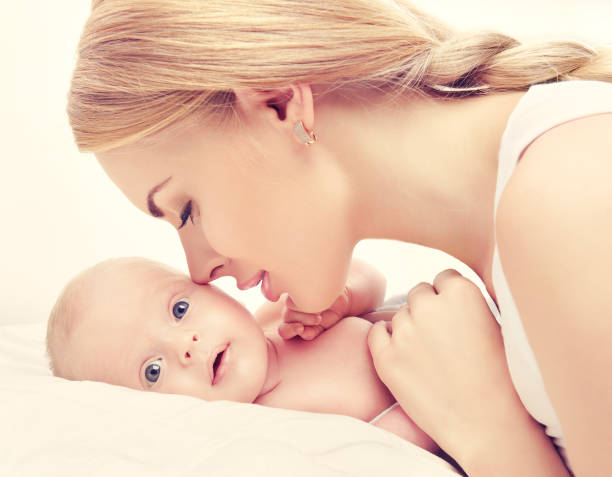 istock Mother with infant child on the hands. 691785938