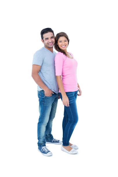 istock Happy couple standing together and looking at camera 691786460