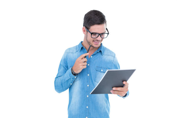 istock Geeky hipster holding book and pen 691789342