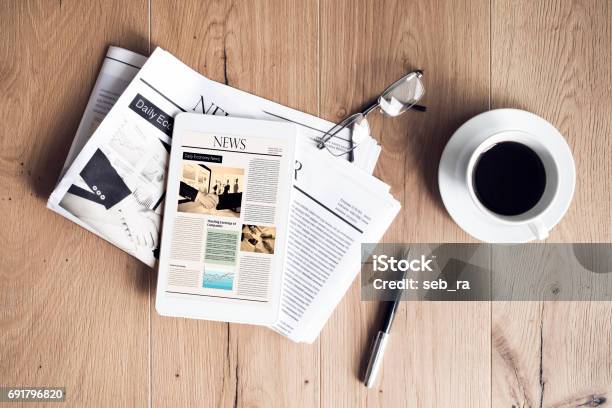 Newspaper With Tablet On Wooden Table Stock Photo - Download Image Now - Newspaper, The Media, Coffee - Drink