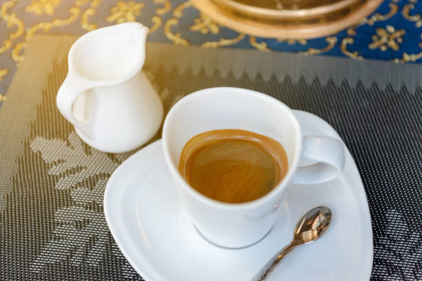 istock cup of hot coffee and milk on table. 691796880