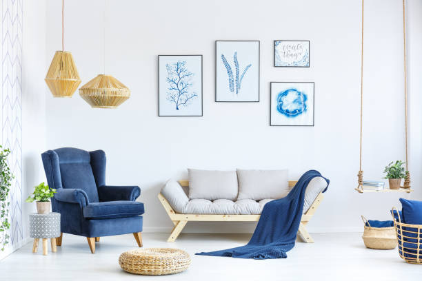 White and blue living room White and blue living room with sofa, armchair, lamp, posters lounge chair photos stock pictures, royalty-free photos & images