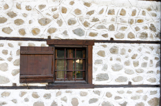 Old window on stone house in Bansko, Bulgaria