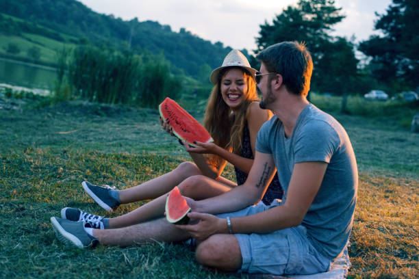 istock Happy couple eating watermelon 691800264