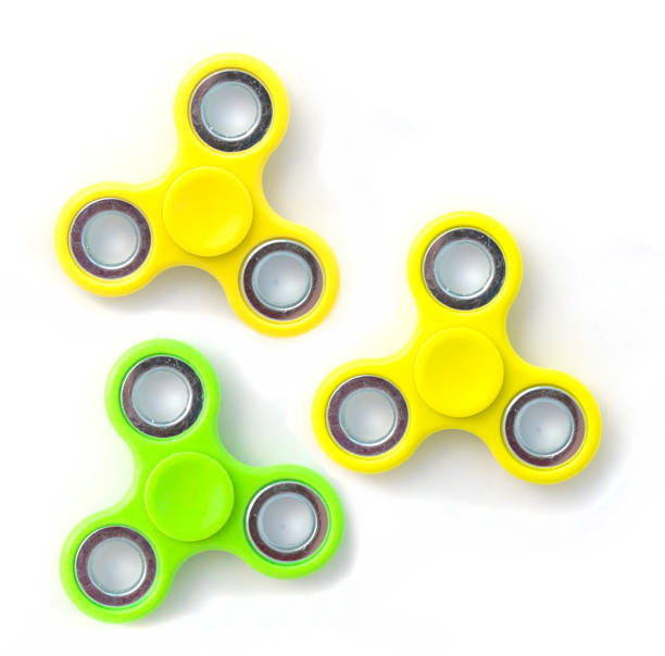 istock Rotating fidget spinner, a stress relief toy on white background. 691802454