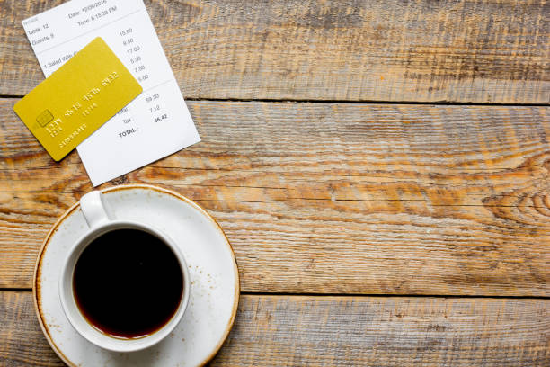 istock restaurant bill, card and coffee on wooden table background top view space for text 691804568