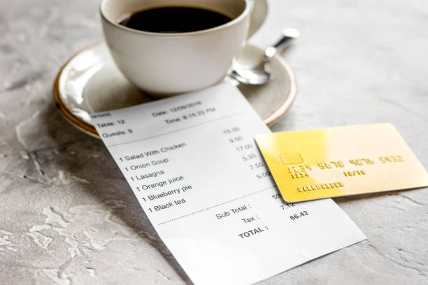 istock coffee and receipt bill for payment by credit card on stone table background 691806946
