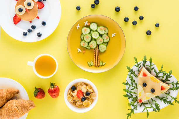 istock top view of creatively styled children's breakfast with croissants and juice 691808310