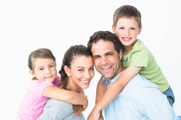 istock Cheerful young family looking at camera together 691810870