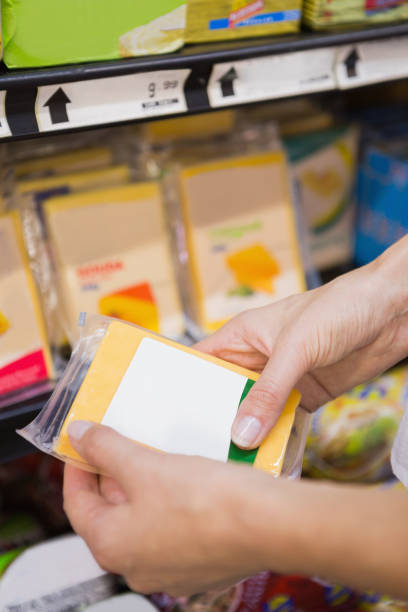 istock A pretty blonde woman buying some cheddar 691814866