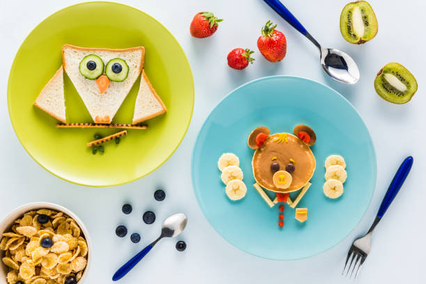 istock flat lay with creatively styled children's breakfast with berries and kiwi 691816052