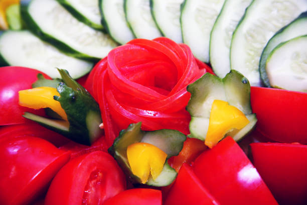 Gourmet salad and soup elegantly arranged on a wooden table with candles and floral centerpiece