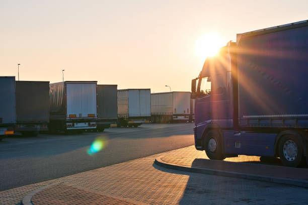 Parked loaded trucks waiting area on border crossing at the evening stock photo