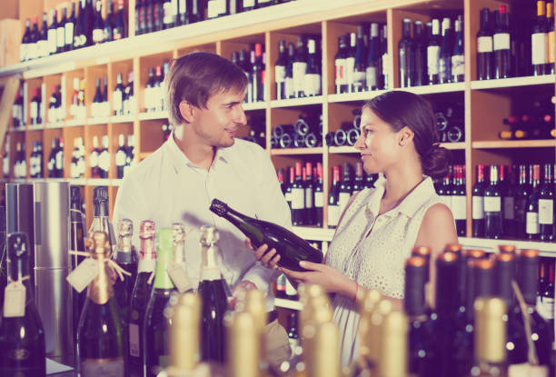 istock Couple buying bottle of wine 691821898