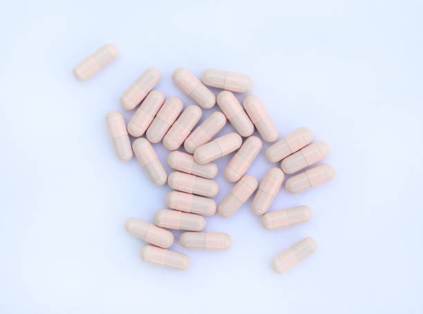 istock medical capsules on white background. 691825864