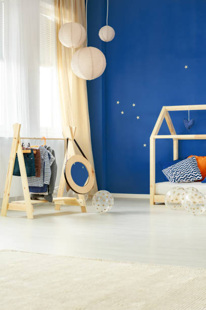 istock Room with kids clothes rack 691826468