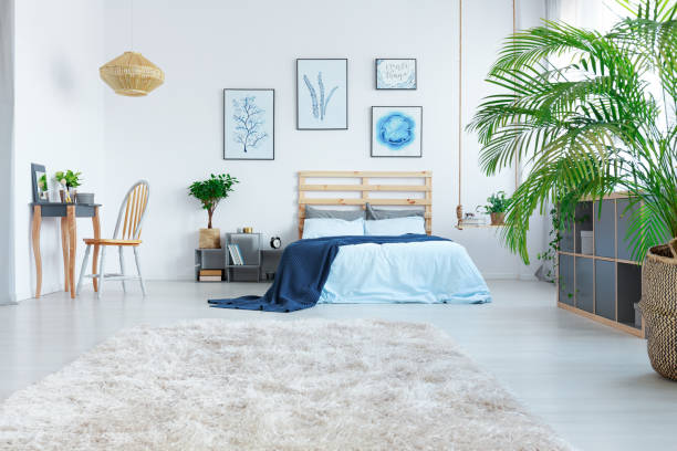istock Stylish bedroom with wooden bed 691826480