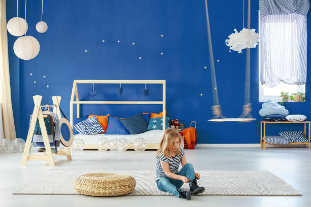 istock Girl bedroom with blue wall 691826484