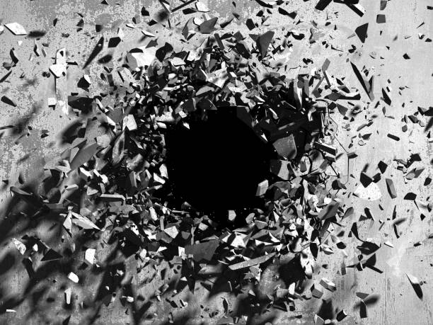 Cracked explosion concrete wall hole abstract background stock photo
