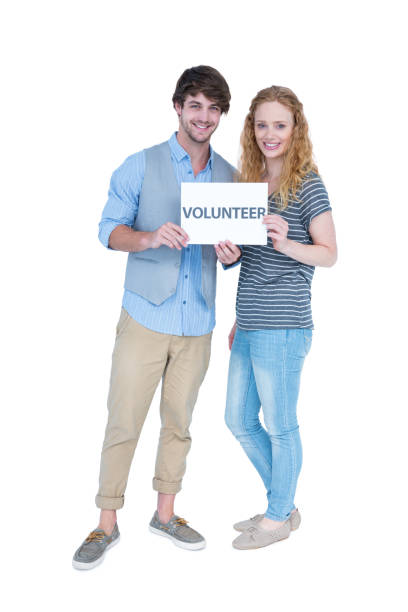 istock Happy couple holding a volunteer note 691829362