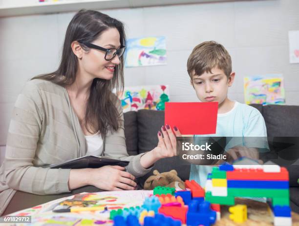 Child Psychologist At Work Stock Photo - Download Image Now - Boys, 8-9 Years, Adult