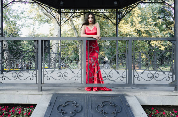 istock gothic woman in red dress 691836564