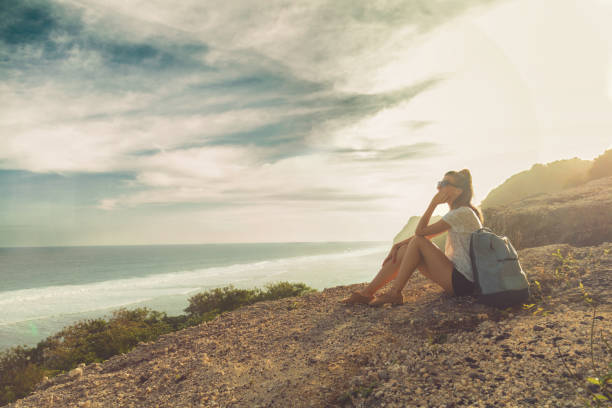 istock Tourist girl with backpack enjoying the view. 691838550