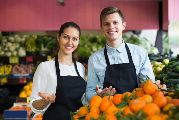 istock Stuff in apron selling sweet oranges, lemons and tangerines 691842638