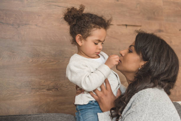 istock mother playing with little daughter while spending time at home 691843520