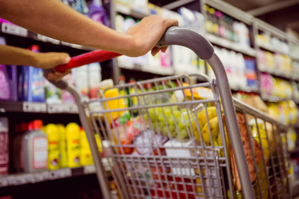 istock woman buy products with her trolley 691843530