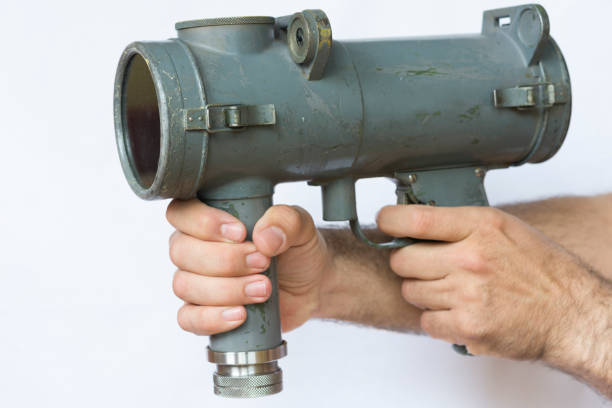istock Naval vintage signal light gun for communication hold by man 691857762
