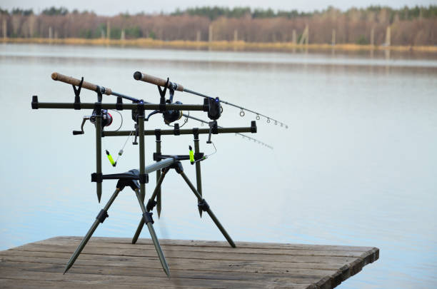 istock Rod pod with feeders with electronic bite alarms on pier 691870248