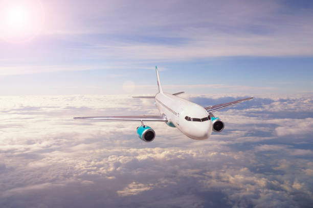 istock Airplane in the sky and cloud at sunset 691870374