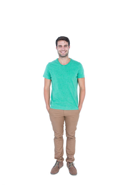 istock Happy handsome man looking at camera with hands in pocket 691871964