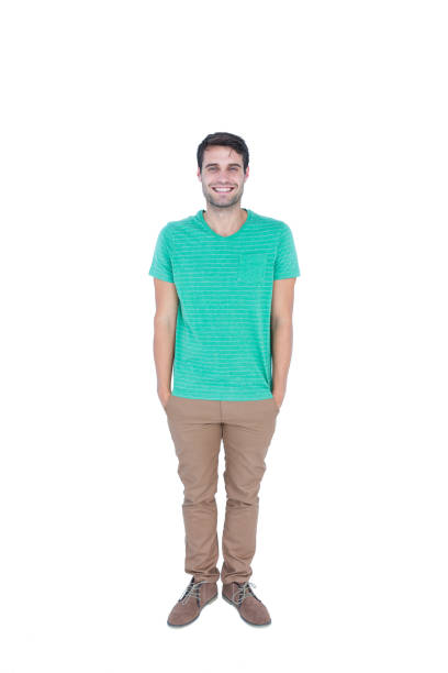 istock Happy handsome man looking at camera with hands in pocket 691872318