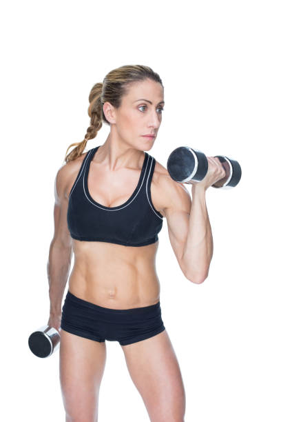 istock Female bodybuilder working out with large dumbbells 691875794