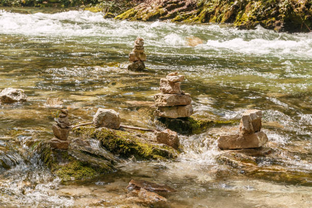 Close-up of stone statues in the water stock photo