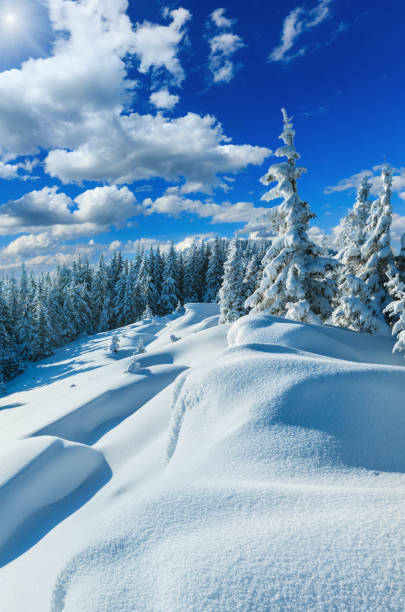istock Snowdrifts on winter snow covered mountainside 691886104