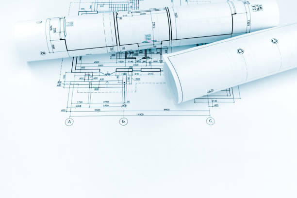 istock architectural plan and rolls of technical drawing of new home 691886316