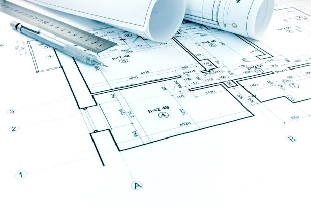 istock rolls of plans, drawing and measurement tools on architectural project 691889486