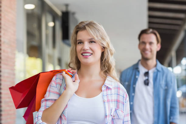 istock A smiling couple with shopping bags 691890472