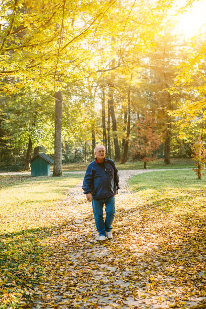 istock Senior man walking and enjoying time together at the park 691899162